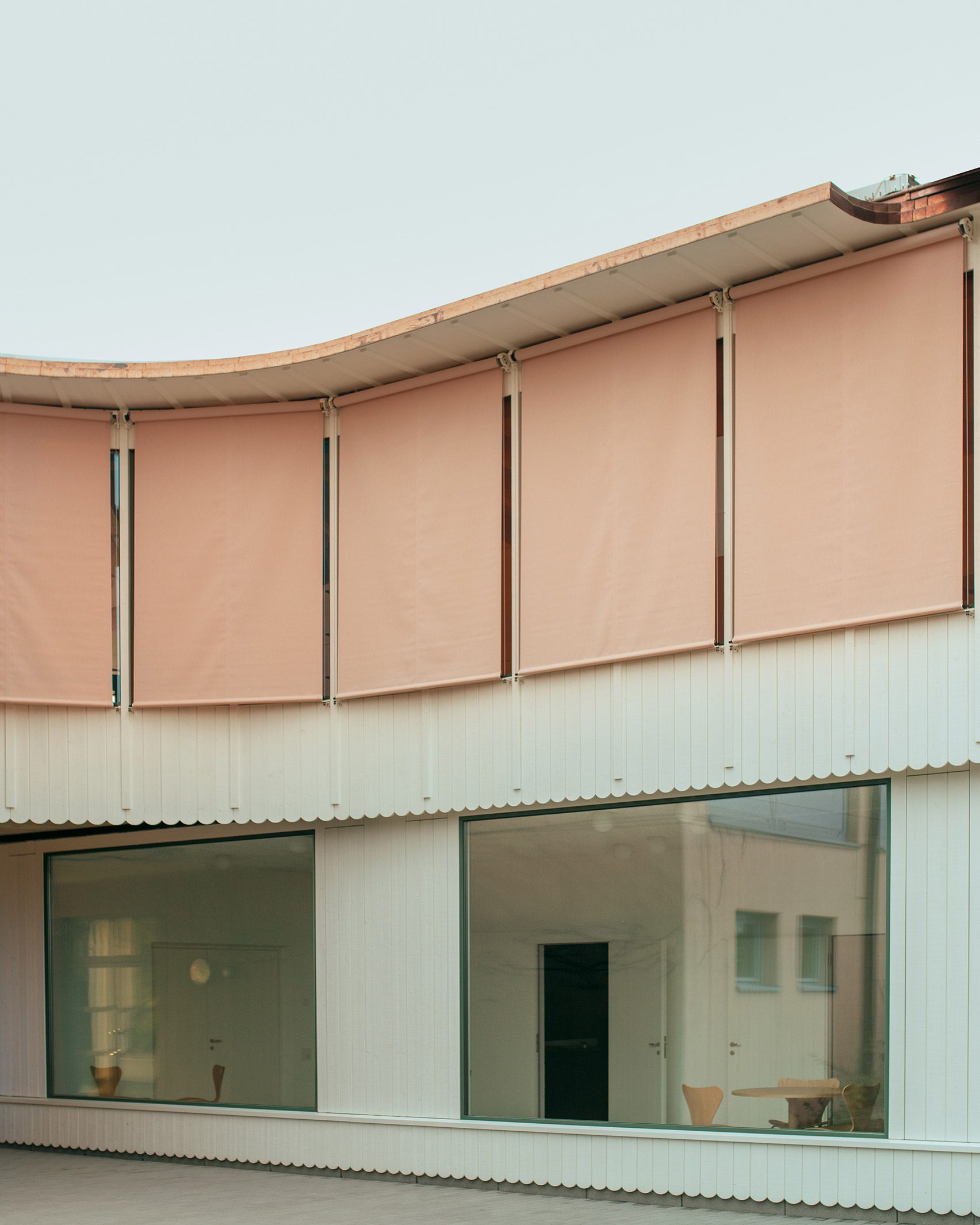 Extension clad in white timber