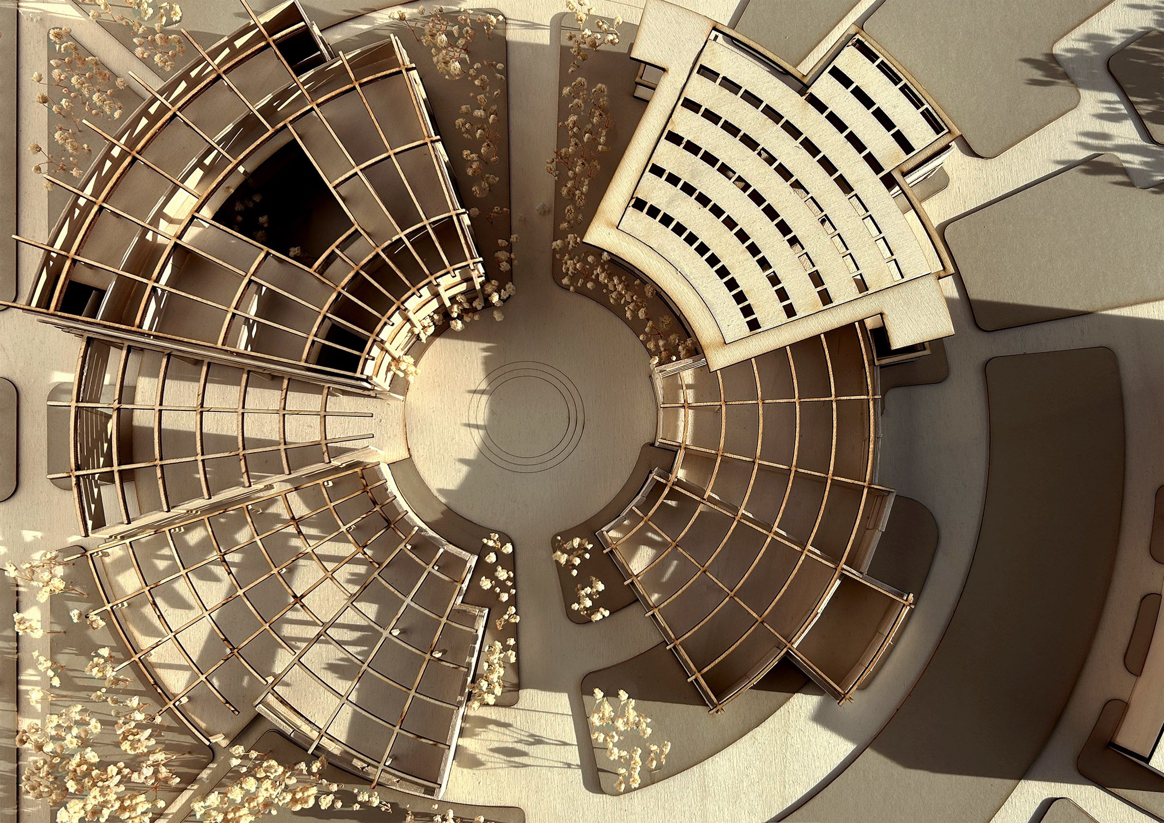 A birds eye view photograph of a 3d architecture model in tones of brown.