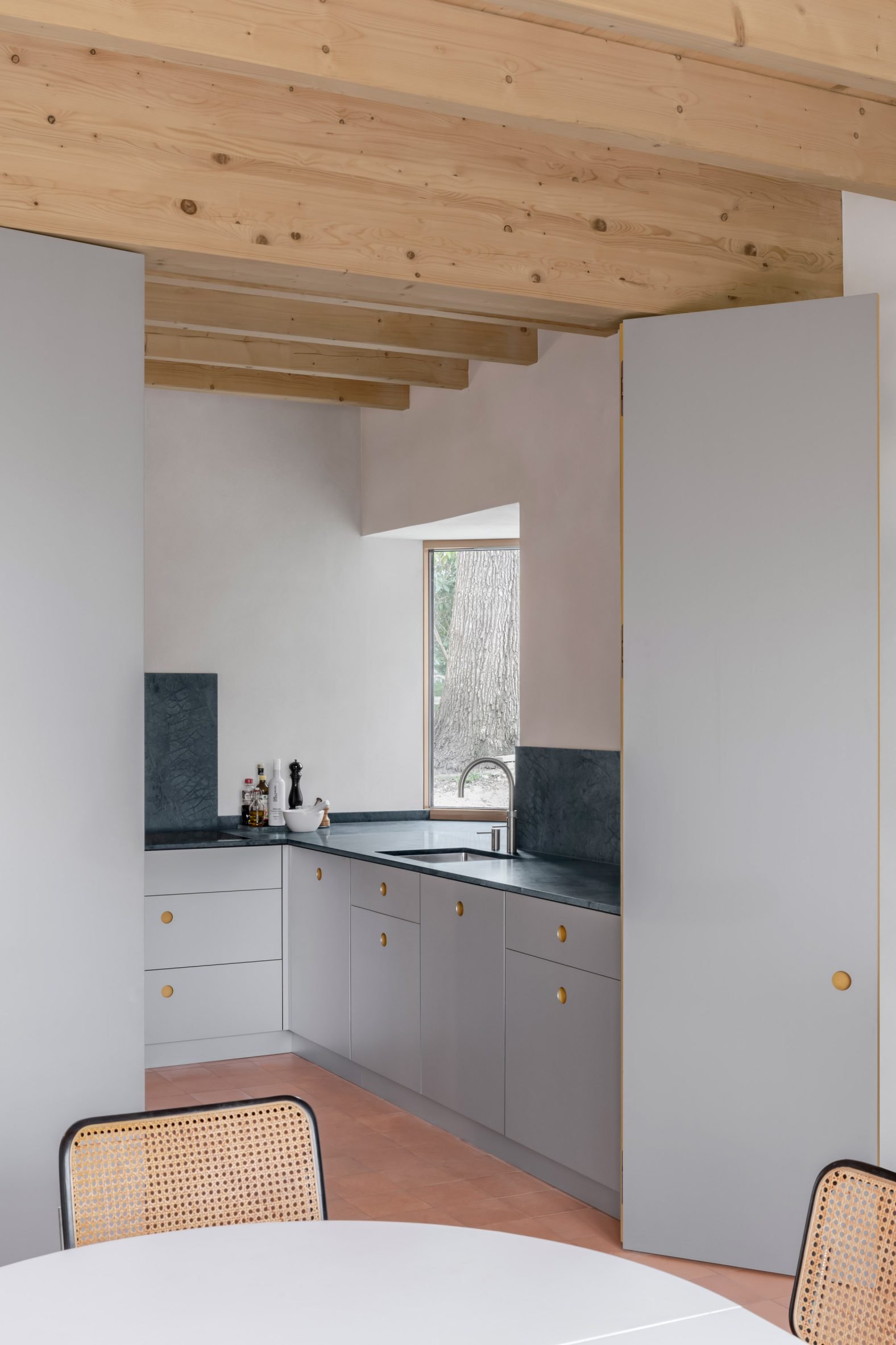 View of kitchen and dining area within Hamburg duplex by NOTO