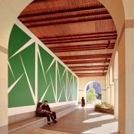 A large green mural underneath a loggia