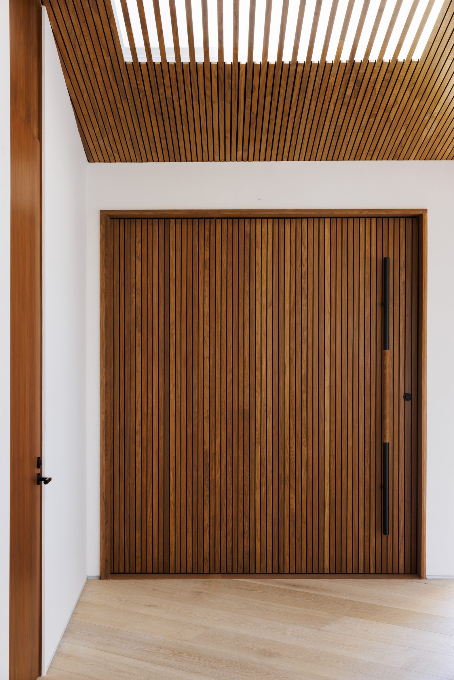 A large, teak front door