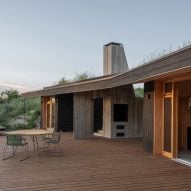 Hello Wood designs grass-topped CLT House as "part of the landscape"