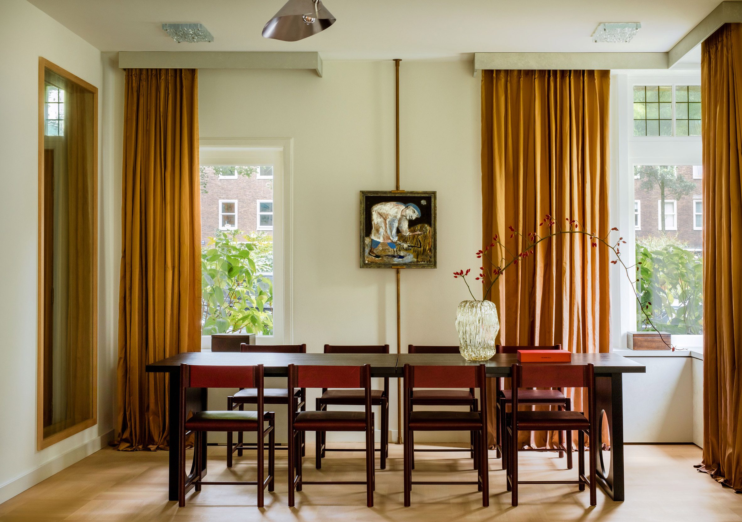 Mustard-coloured curtains in the dining space