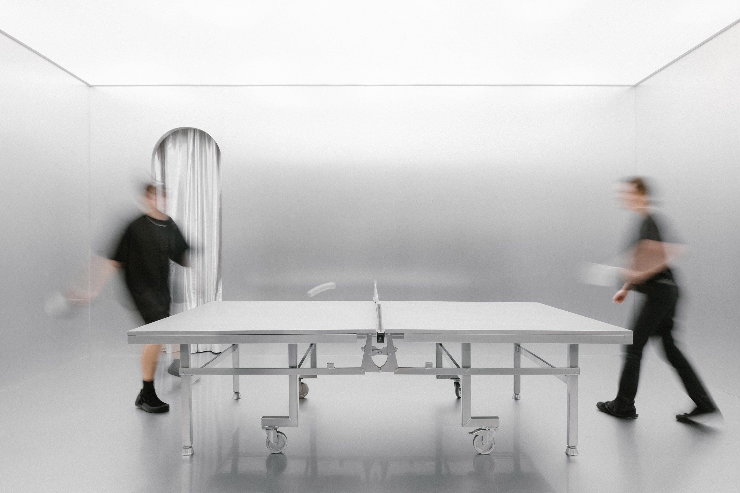 People playing ping-pong at immersive installation by Crosby Studios
