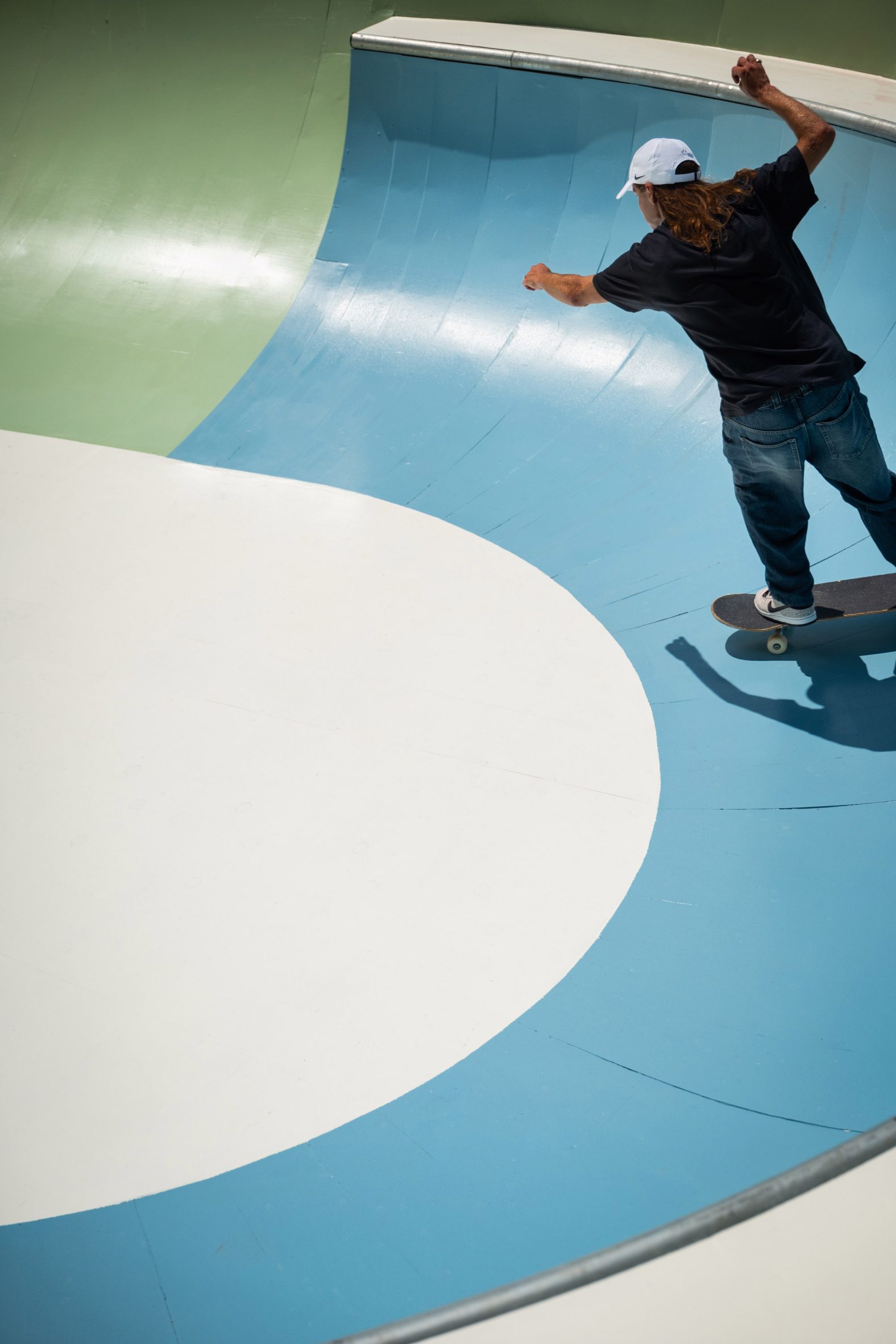 Person skating in bowl at Cycloid Piazza skatepark