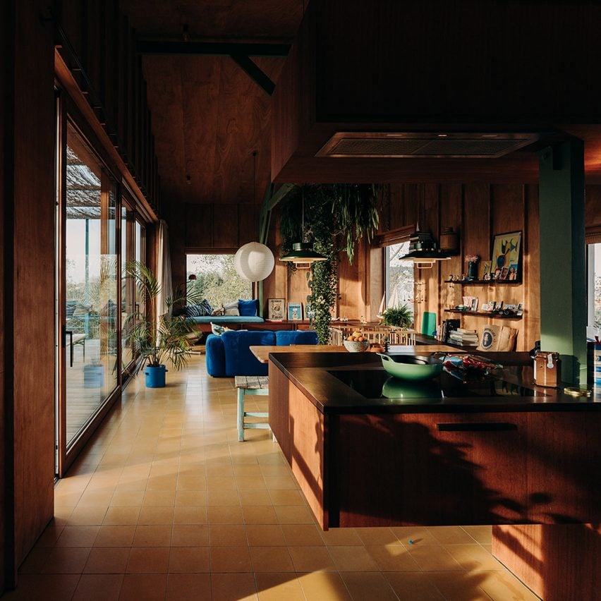 OYO transforms derelict Dune House in Belgium with warm wood interiors