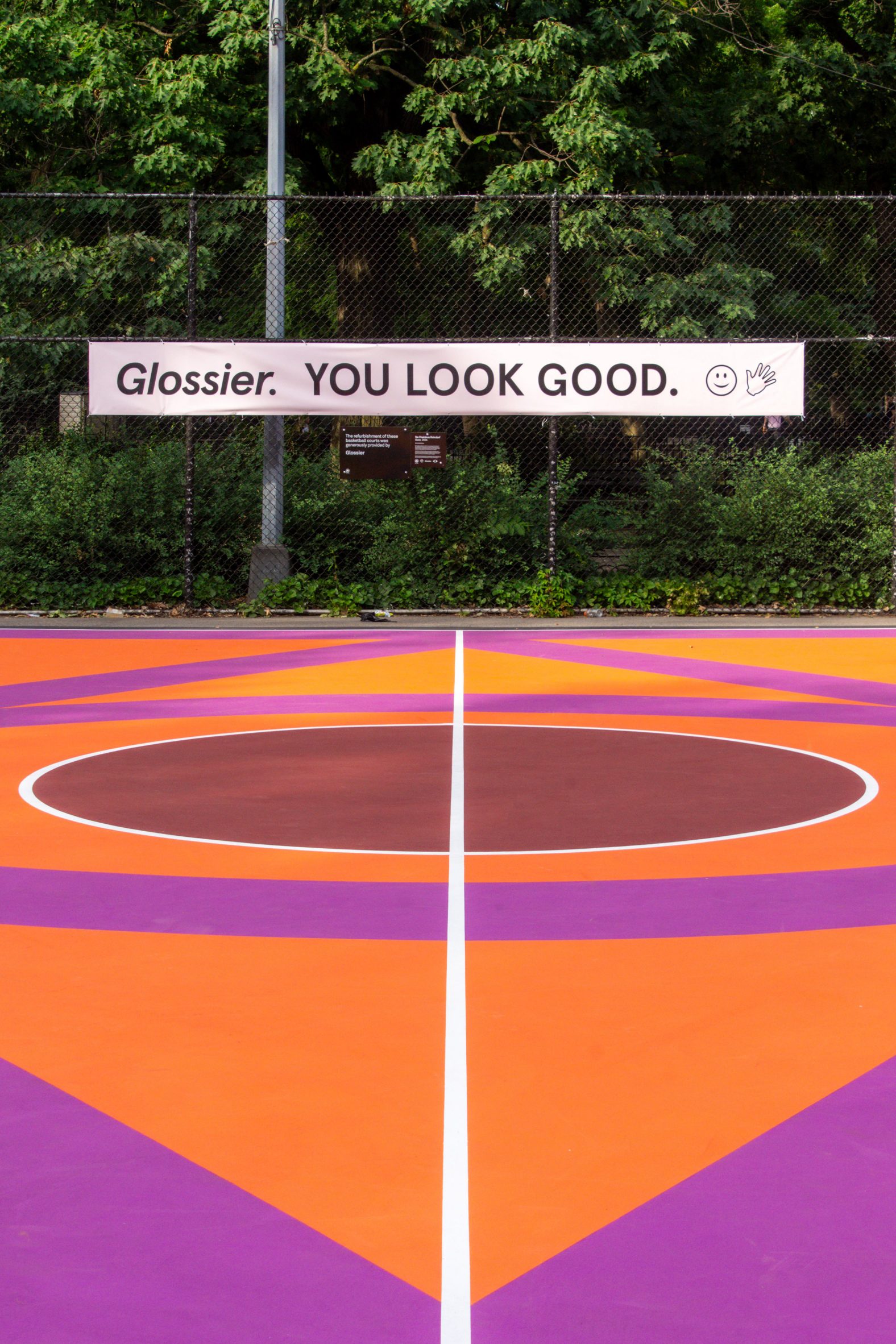 Glossier banner at Tompkins Square Park Basketball Court