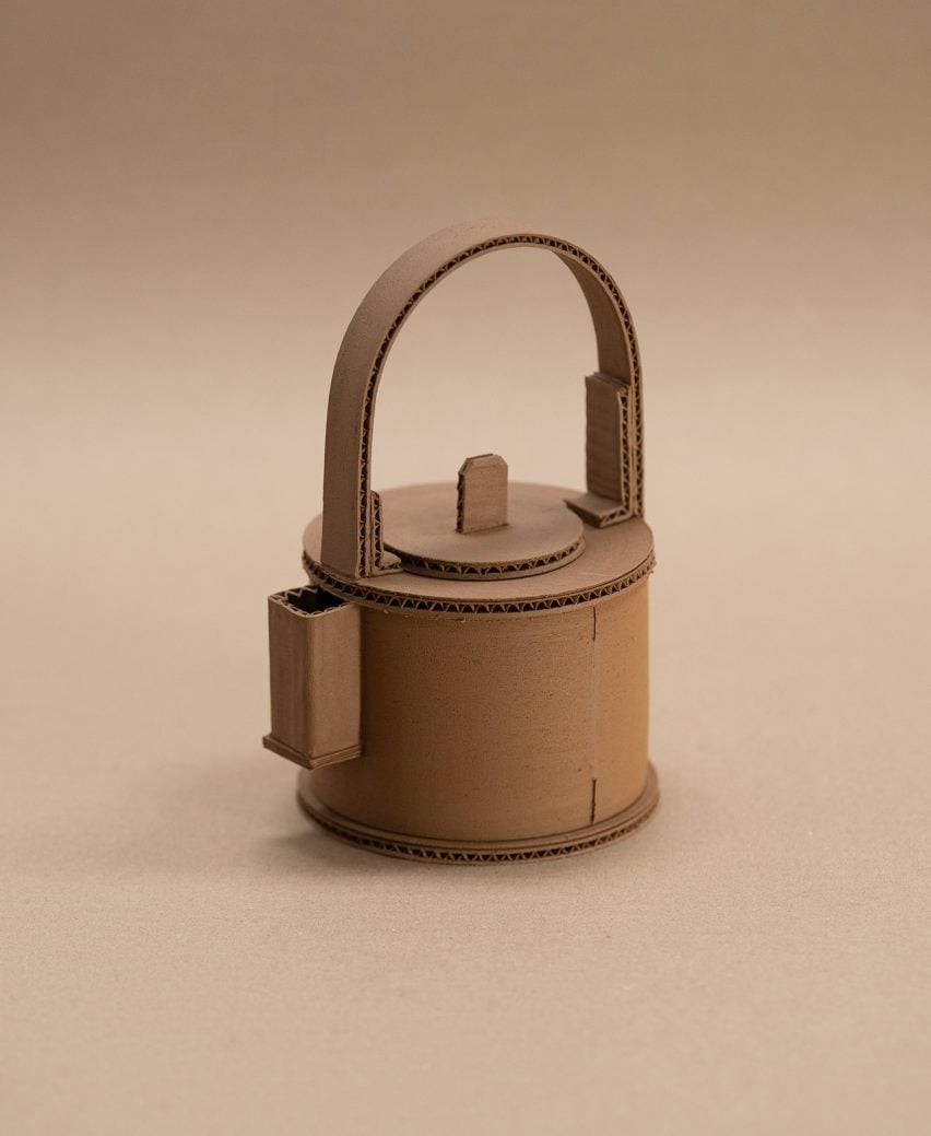 A photograph of a brown ceramic teapot against a brown backdrop.