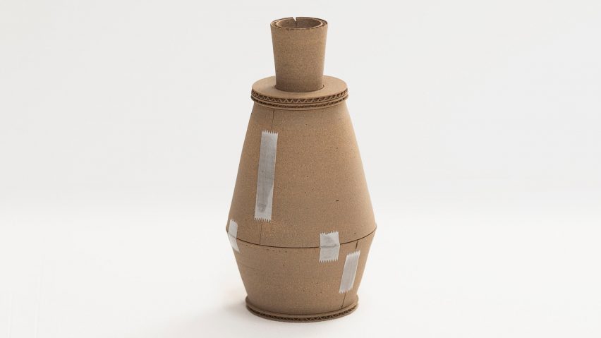 A photograph of a brown ceramic vase against a white backdrop.