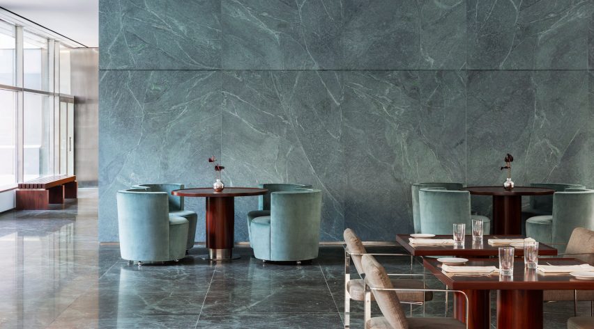 Restaurant area with green walls, floor and furniture