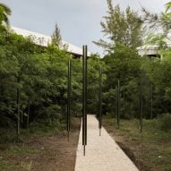 Limbo Accra opens up abandoned Cayman Islands hotel with aluminium-pole sculpture garden
