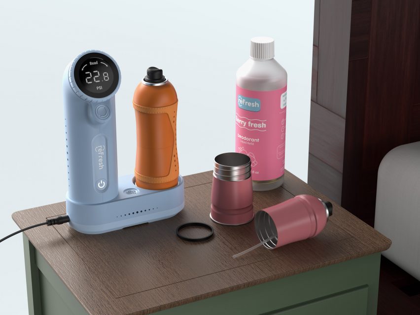 A visualisation of a blue electronic device and two aerosol cans in tones of orange and pink, with a pink bottle beside them, atop a brown surface.