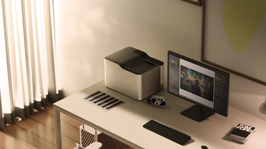 A visualisation of a room in neutral tones with a computer and another device on a desk.