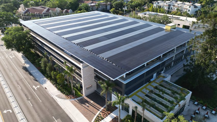 Building with roof topped with solar panels