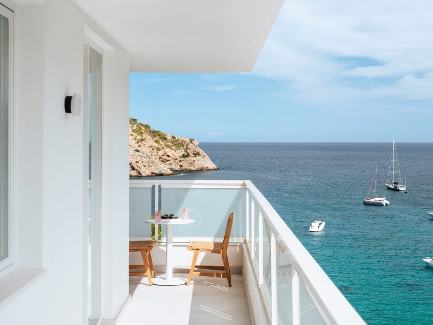 Balcony with table and chairs overlooking the bay