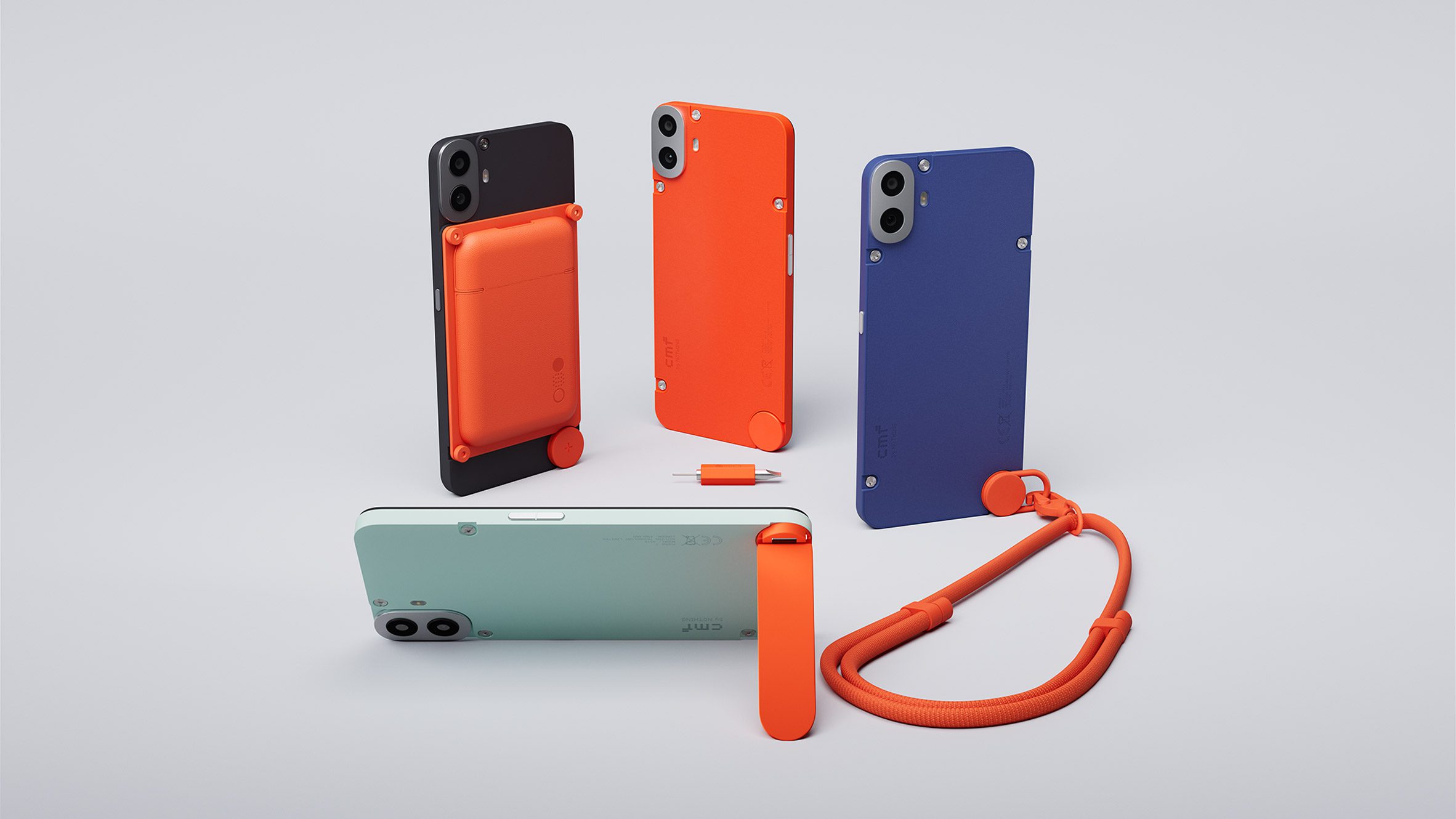 Photo of all four colours of the CMF Phone 1 with various phones showing the card holder, lanyard and stand accessories attached