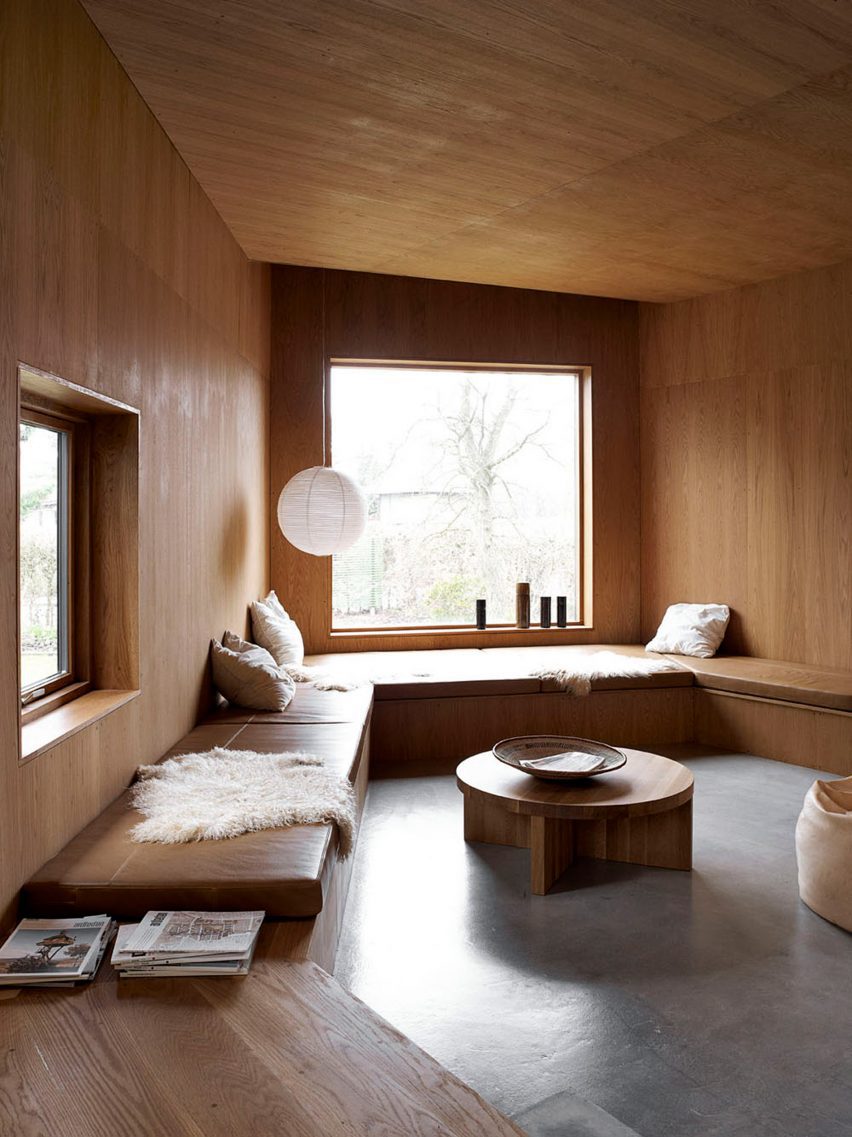 Oak-lined living room with a paper lamp