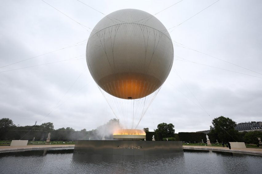 Olympic cauldron 2024 flying above water