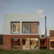 Brick and stucco meet for "harmonious flow" of Quito house