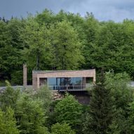 Henkai Architekti clads mountain visitor centre in wooden shingles