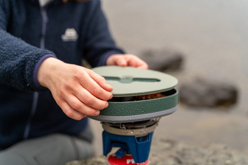 Food container being heated on a camping stove