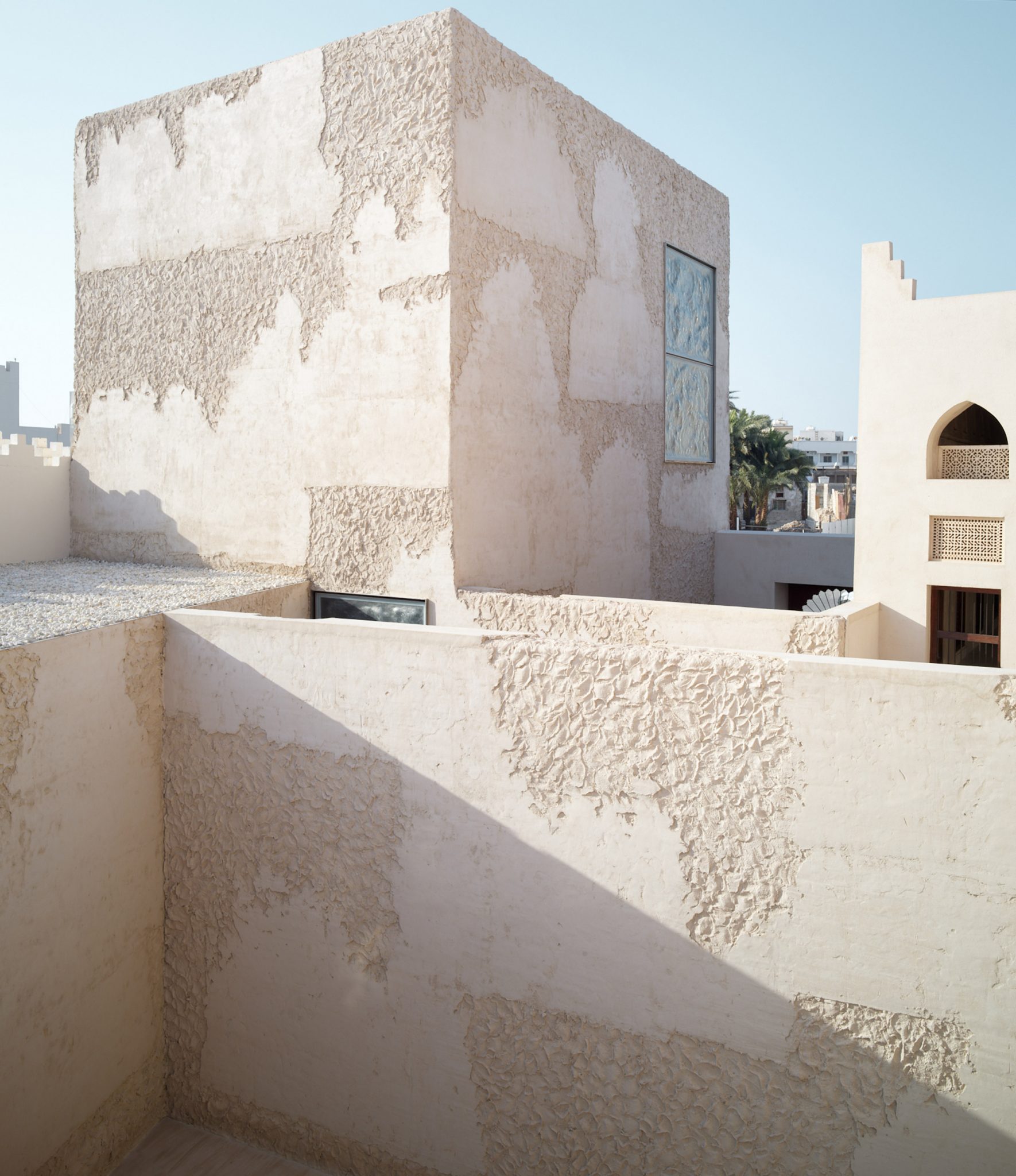 Studio Anne Holtrop adds textured plaster walls to Bahrain pearl museum ...