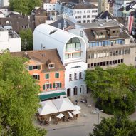 Herzog & de Meuron inserts arched apartment behind old facade in Austria