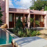 Pink plaster cloaks limestone house in Kenya by Studio Mehta Architecture