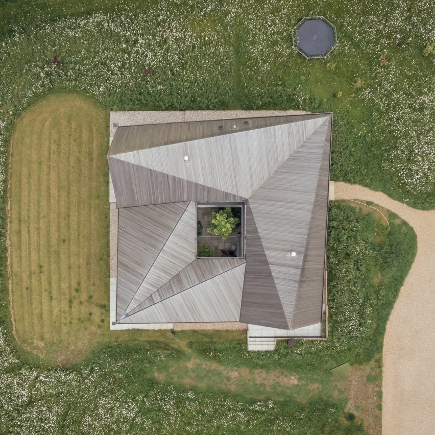 Origami-like roof tops timber home in Sussex by Studio Bark