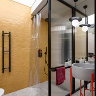 Yellow tiles and textured glass in bathroom