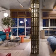 Concrete and glass pillar partition between bedroom and living area Suprematism apartment