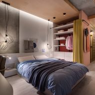 Platform bed with wardrobe and yellow dividing curtain