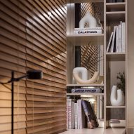 Desk with shelving area and wooden blinds