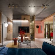 Sofa looking out over open plan living space with concrete pillar