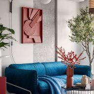 Blue velvet sofa with wall panel by artist Tasha Oro