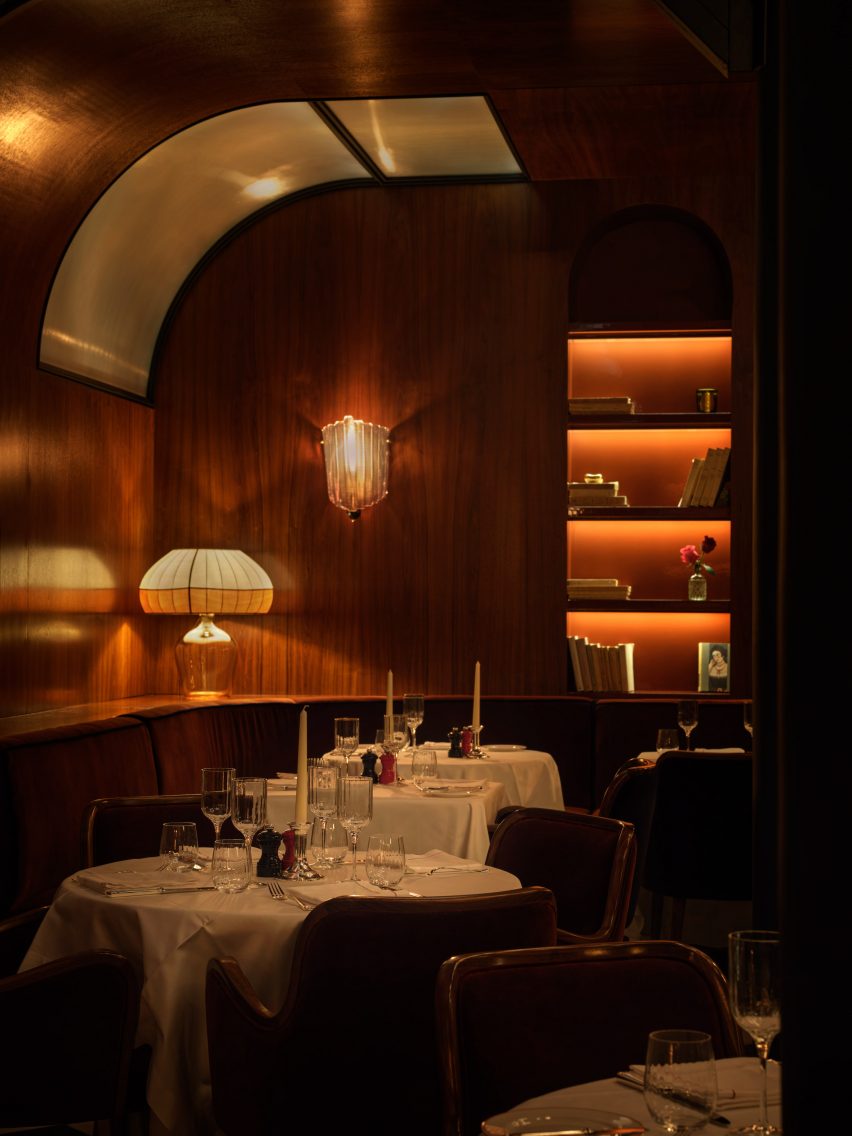 Curved wood panelling is used in the dining room