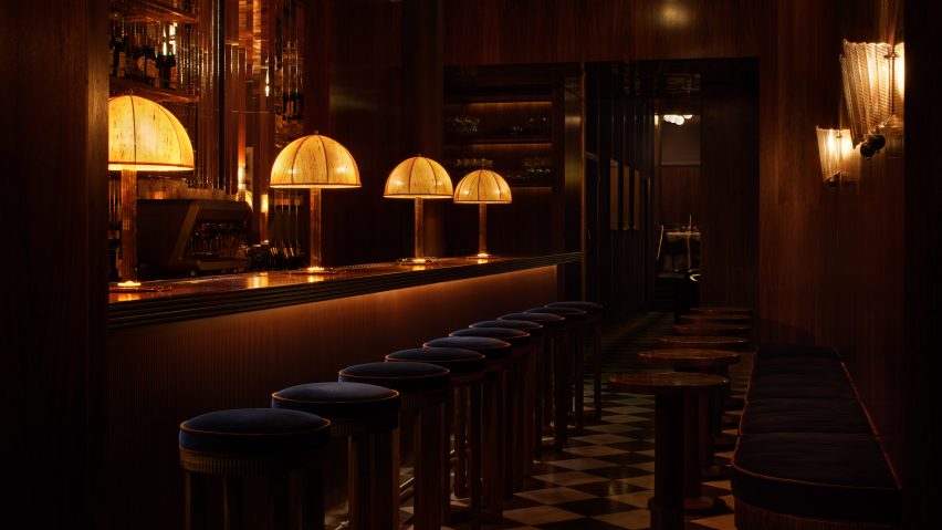 Restaurant bar with lamps and stools