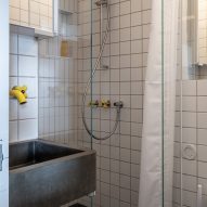 Bathroom with yellow taps in Trellick apartment by Archmongers