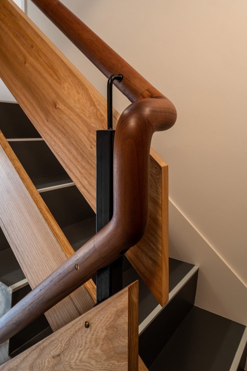 Walnut handrail in Trellick apartment by Archmongers