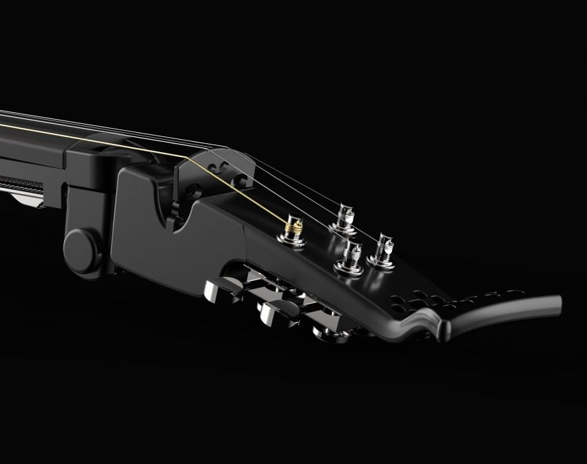 An image displaying part of a stringed musical instrument in tones of black.