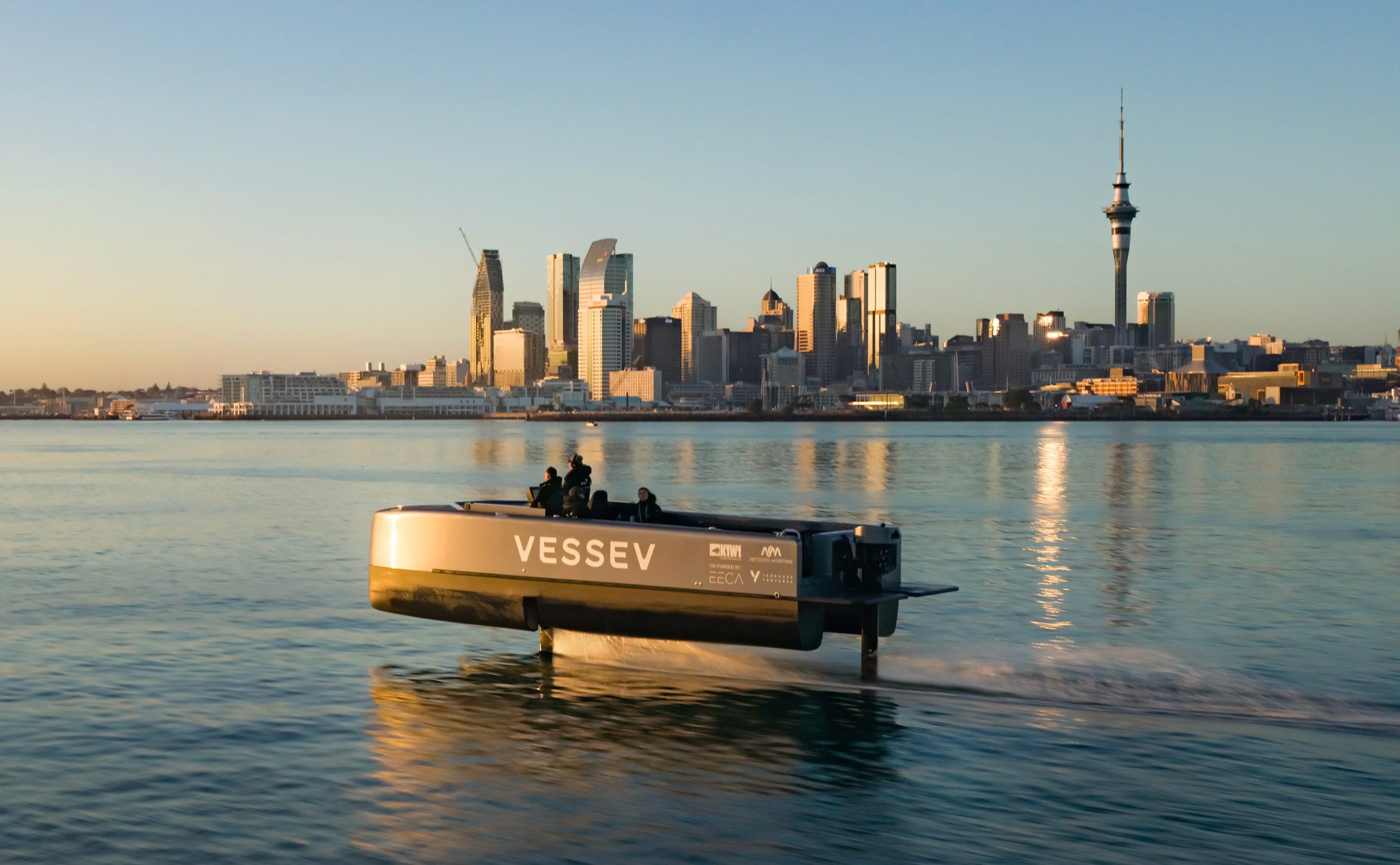 Vessev V-9 hydrofoil ferry captured via drone in front of the Auckland skyline