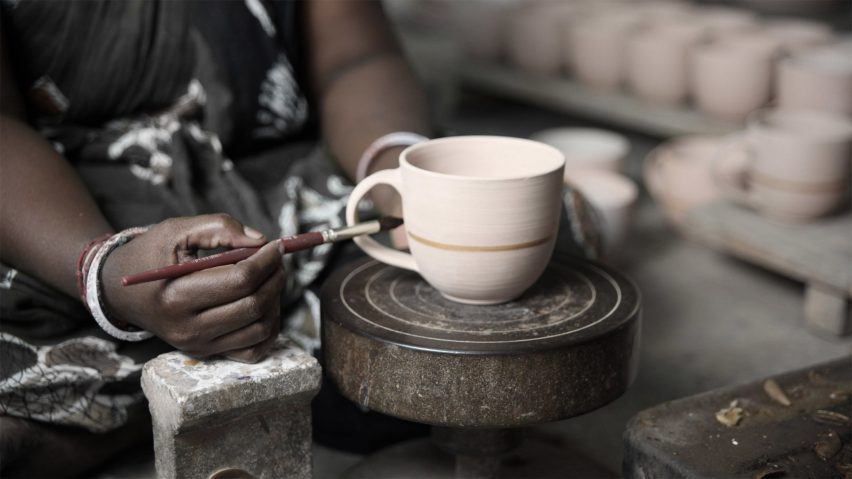 Photo of person crafting a mug