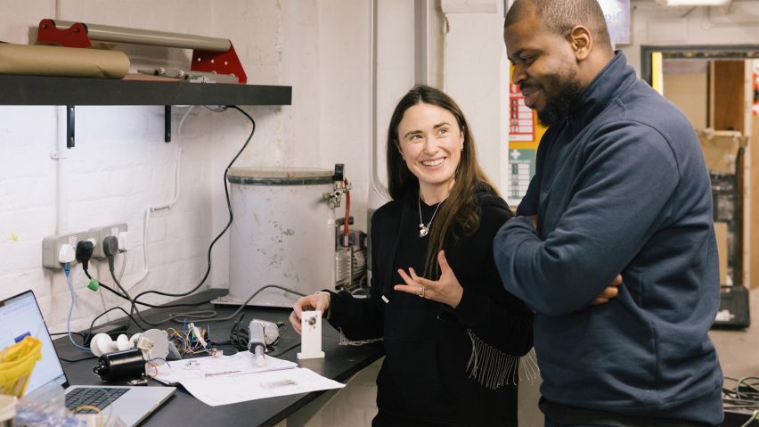 Photo of two people interacting with technical equipment