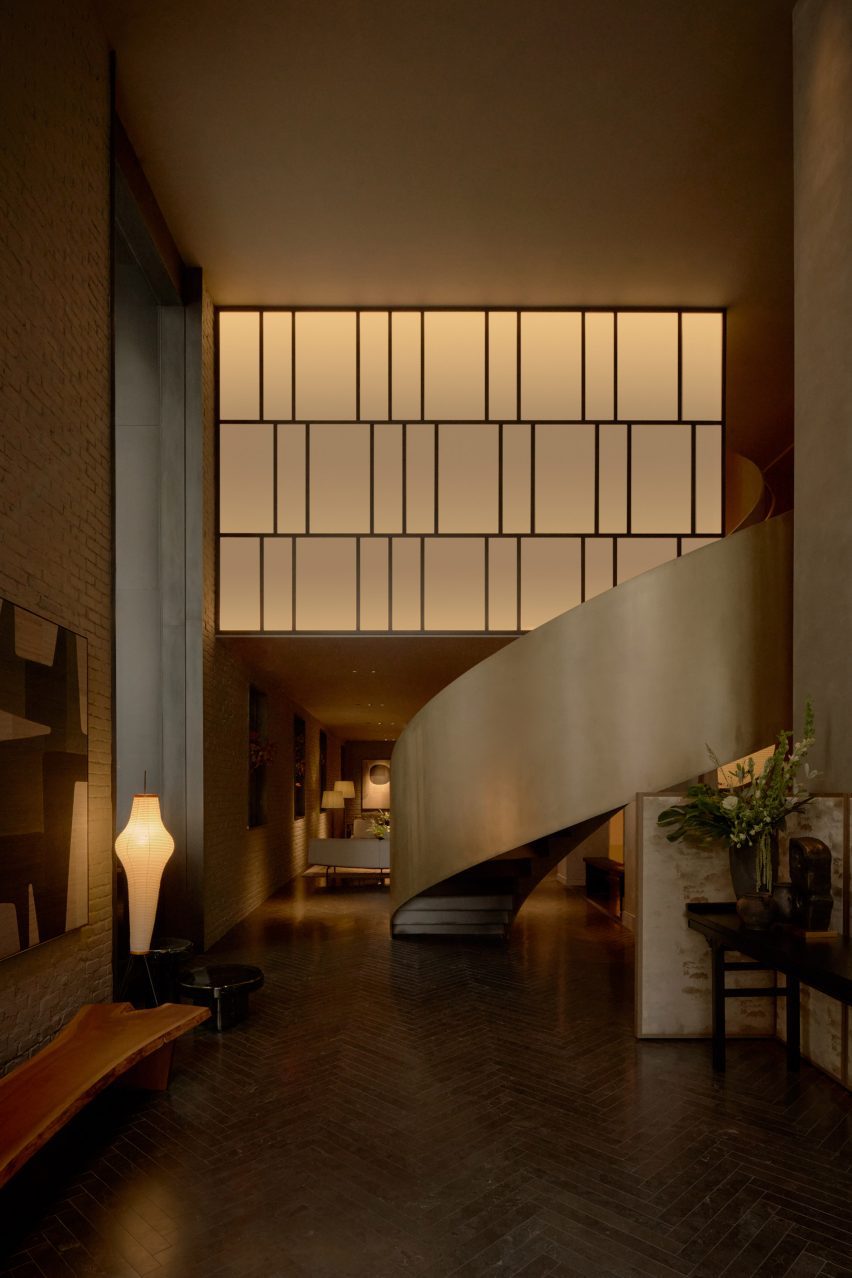 Hotel lobby with a bronze-painted spiral staircase