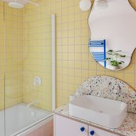 Bathroom with pink and yellow tiles