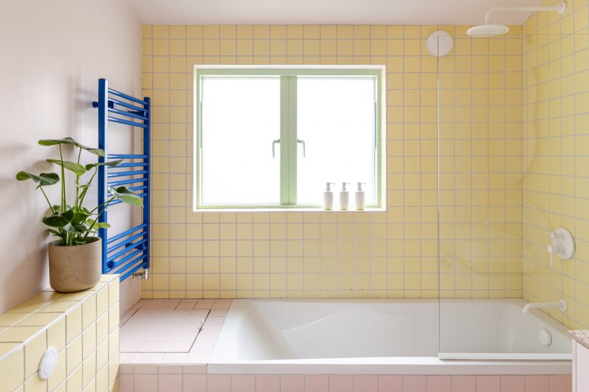 Bathroom with pink and yellow tiles