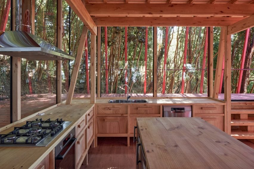 Light timber-clad kitchen designed by Guillermo Acuña Arquitectos Asociados