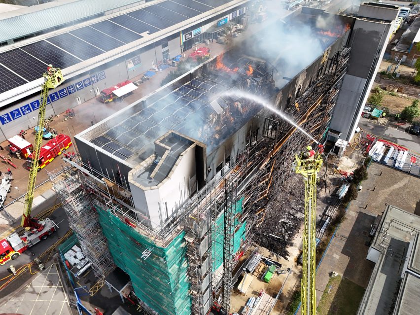 Firefighters dousing a blaze at a building in east London