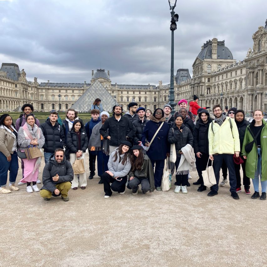 a group of students outside the Louvre museum