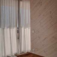 Hallway with light wood and curtain